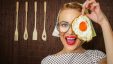 Woman Smiling Holding A Fried Egg 780x439