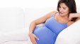 Pregnant Woman On Couch 650x358