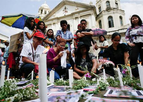 Filipino Families Of Human Rights Victims Offer Flowers And Candles On All Souls Day
