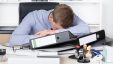 Young Exhausted Man Is Lying On The Desk In Office 770x433