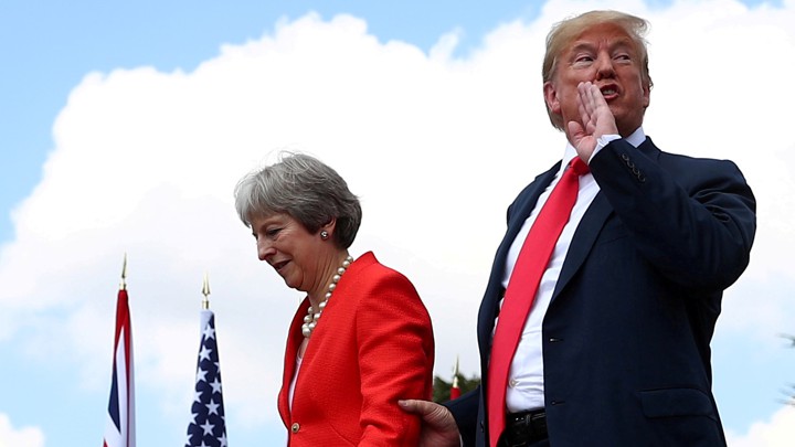 File Photo: Britain's Prime Minister Theresa May And U.s. President Donald Trump Walk After Holding A Joint News Conference At Chequers, The Official Country Residence Of The Prime Minister, Near Aylesbury