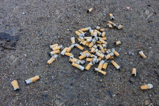 50104849 Cigarette Butts On Ground 696x464