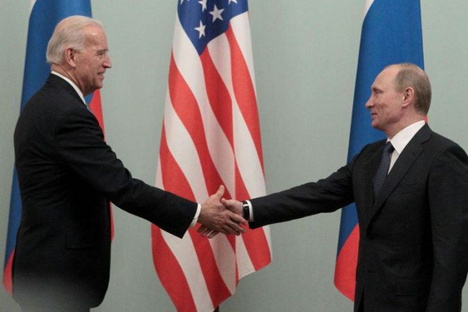 File Photo: Russian Prime Minister Putin Shakes Hands With U.s. Vice President Biden During Their Meeting In Moscow