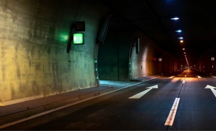 Underground Tunnel With White Arrows On The Asphalt Indicating The Way 1536x931