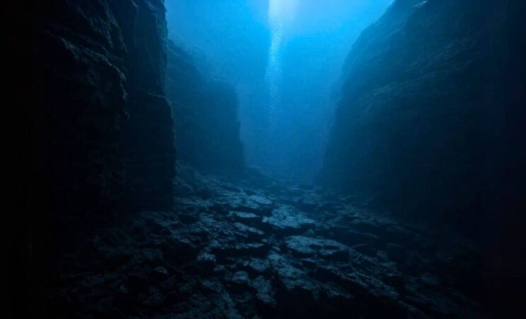 A Dark And Mysterious Deep Sea Trench Scene Beneath The Pacific Ocean 1200x727