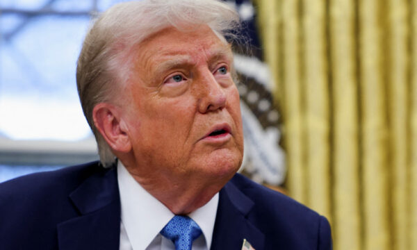 U.s. President Donald Trump Signs An Executive Order In The Oval Office At The White House