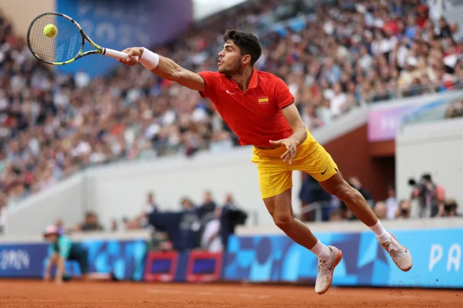 Carlos Alcaraz Stretches For The Ball During Mens Singles First Round Match At Olympic Summer Games Paris 2024